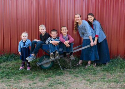 Group of kids in a wheel barrow