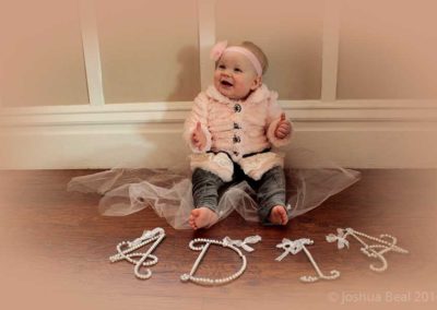 Name in front of baby for her firrst birthday