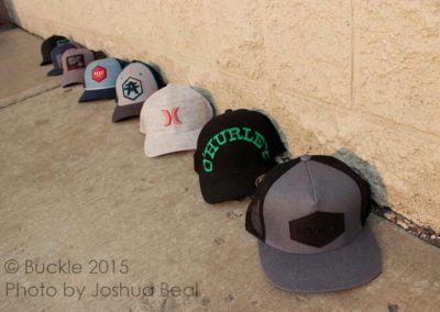 Hats along a wall